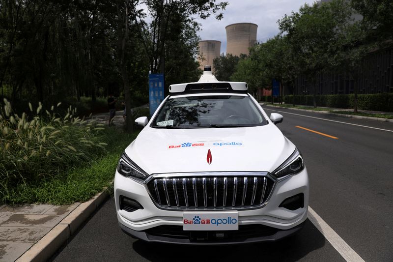 © Reuters. FILE PHOTO: Baidu's Apollo car with an autonomous driving system, which serves for self-driving taxi services, is seen at the Shougang Industry Park in Beijing, China July 30, 2021. REUTERS/Tingshu Wang/File Photo
