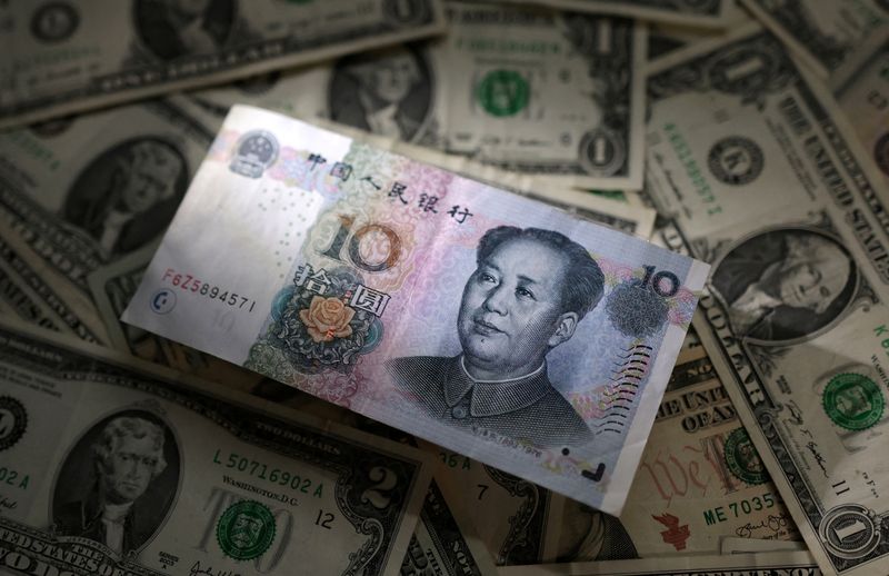 &copy; Reuters. Chinese Yuan and U.S. dollar banknotes are seen in this illustration taken March 10, 2023. REUTERS/Dado Ruvic/Illustration/File Photo