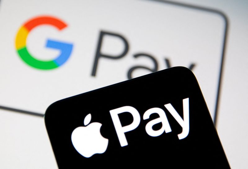 &copy; Reuters. A smartphone with the Apple Pay logo is placed on a displayed Google Pay logo in this illustration taken on July 14, 2021. REUTERS/Dado Ruvic/Illustration