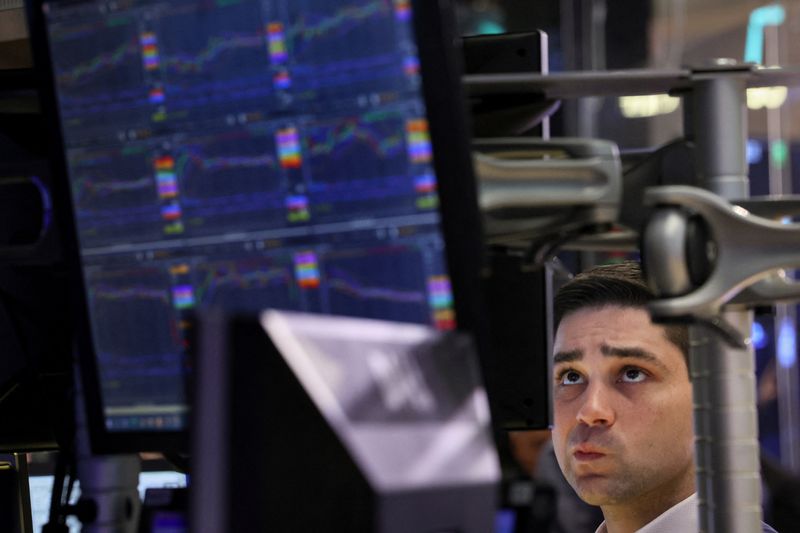 &copy; Reuters. FILE PHOTO: A trader works on the floor at the New York Stock Exchange (NYSE) in New York City, U.S., November 16, 2023.  REUTERS/Brendan McDermid/File Photo