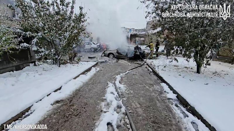 &copy; Reuters. First responders work near burnt-out cars after a reported deadly Russian artillery strike in Kherson, Ukraine, in this still image from handout video released November 20, 2023. Kherson Regional State Administration/Handout via REUTERS/ File Photo