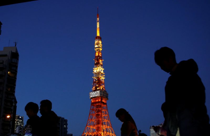 &copy; Reuters. Pedestrians are silhouetted as they walk past the Tokyo Tower in Tokyo, Japan December 26, 2017. REUTERS/Kim Kyung-Hoon/File Photo