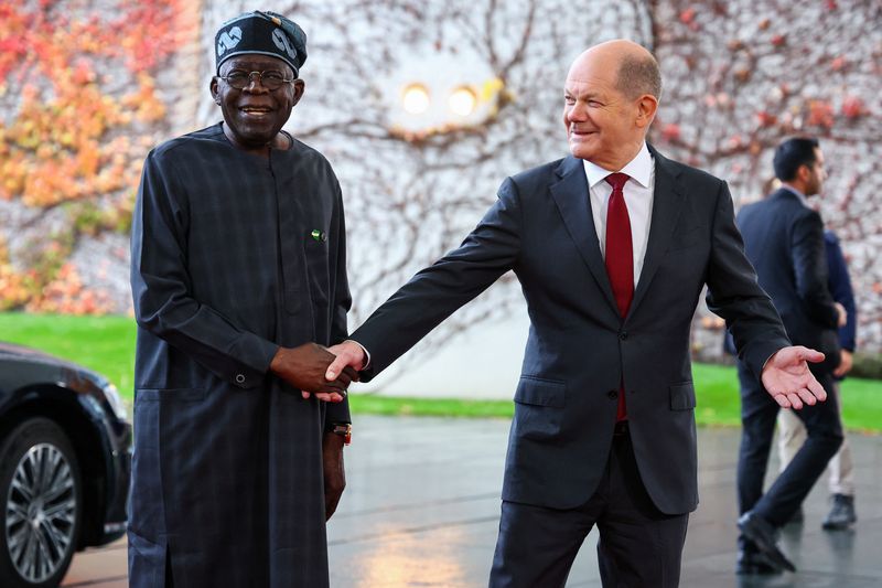 &copy; Reuters. German Chancellor Olaf Scholz shakes hands with Nigerian President Bola Tinubu, during the "Compact with Africa" investment summit, at the Chancellery in Berlin, Germany, November 20, 2023. REUTERS/Fabrizio Bensch