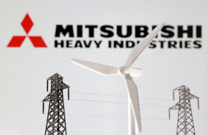 &copy; Reuters. FILE PHOTO: Miniatures of windmill and electric pole are seen in front of Mitsubishi Heavy Industries logo in this illustration taken January 17, 2023. REUTERS/Dado Ruvic/Illustration