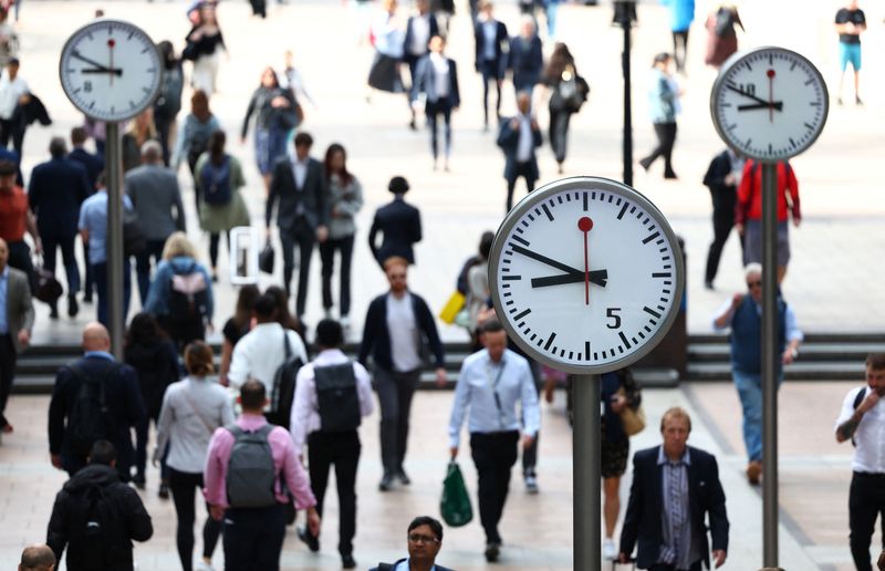 &copy; Reuters. Workers walk through the Canary Wharf financial district, ahead of a Bank of England decision on interest rate changes, in London, Britain, August 3, 2023. REUTERS/Toby Melville/File Photo