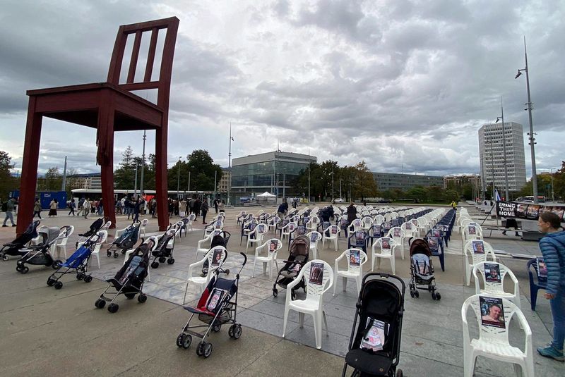&copy; Reuters. A group of Geneva citizens set up 222 empty chairs and strollers for children that symbolically represent hostages and missing people waiting to come home, following a deadly infiltration of Israel by Hamas gunmen from the Gaza Strip, on Place des Nations