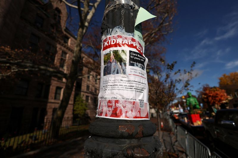 &copy; Reuters. A poster featuring a picture with the word "kidnapped" hangs, amid the ongoing conflict between Israel and the Palestinian Islamist group Hamas, from a pole by the Macy's Thanksgiving Day Parade inflation area the day before the Macy's Thanksgiving Day Pa