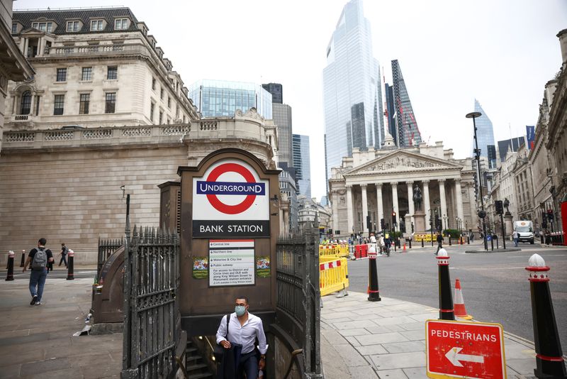 &copy; Reuters. FILE PHOTO: A person exits Bank underground station in the City of London financial district, in London, Britain, June 11, 2021. REUTERS/Henry Nicholls/File Photo