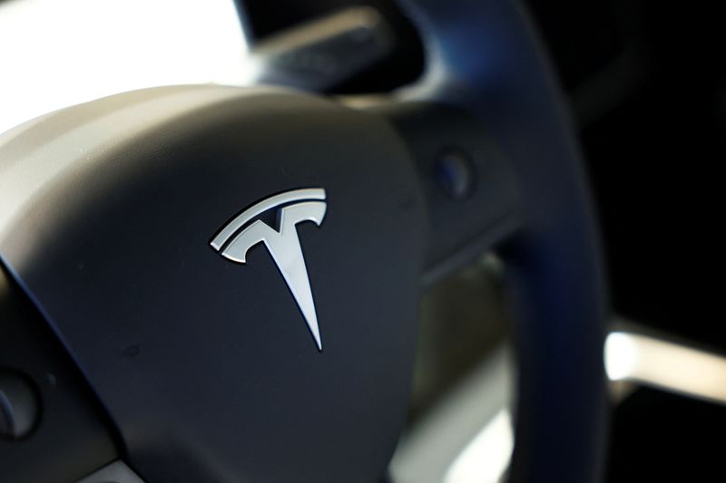 &copy; Reuters. Tesla logo is seen on the steering wheel of an electric vehicle at a dealership in Durango, northern Spain, October 30, 2023. REUTERS/Vincent West/File Photo