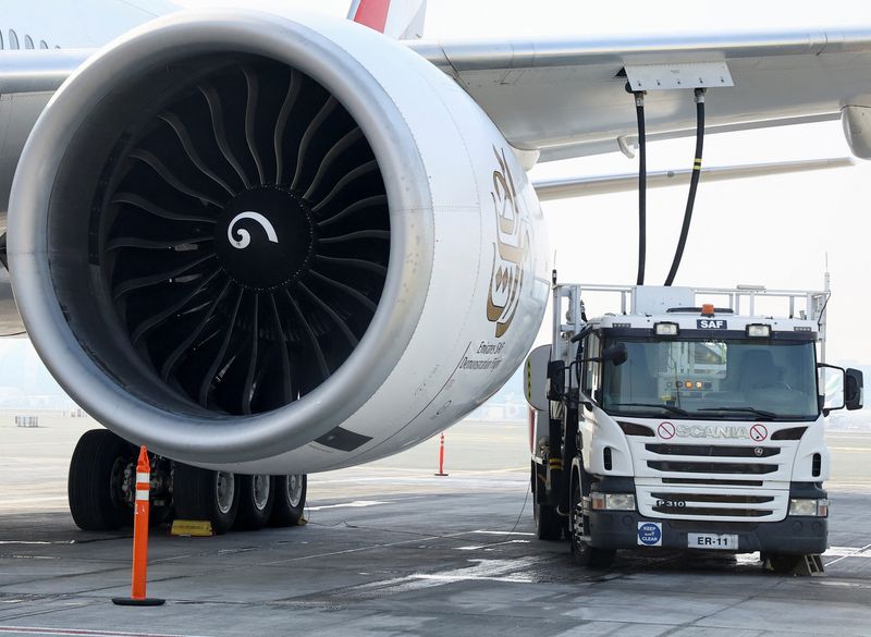 &copy; Reuters. A fuel truck fills up the Emirates Airlines Boeing 777-300ER with Sustainable Aviation Fuel (SAF), during a milestone demonstration flight while running one of its engines on 100% (SAF) at Dubai airport, in Dubai, United Arab Emirates, January 30, 2023. R