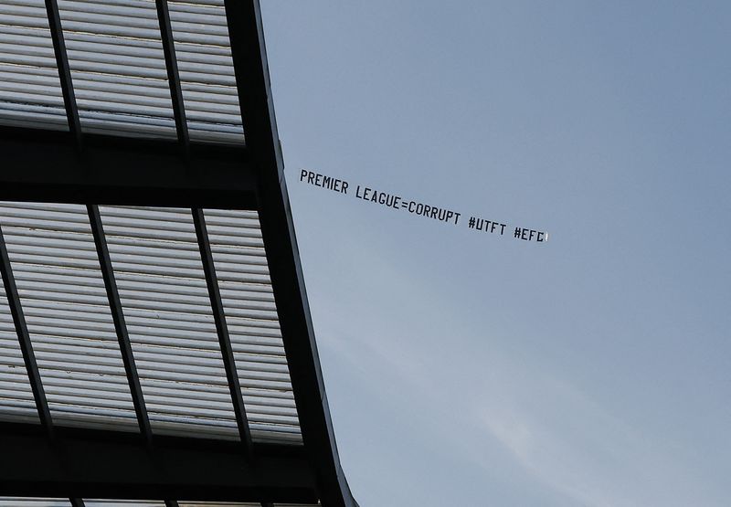 &copy; Reuters. Soccer Football - Premier League - Manchester City v Liverpool - Etihad Stadium, Manchester, Britain - November 25, 2023 General view as plane flies over the stadium displaying a message reading "Premier League equals corrupt" during the match Action Imag