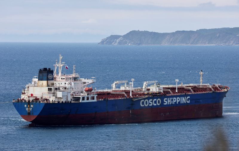 &copy; Reuters. FILE PHOTO: Yang Mei Hu oil products tanker owned by COSCO Shipping gets moored at the crude oil terminal Kozmino on the shore of Nakhodka Bay near the port city of Nakhodka, Russia June 13, 2022. REUTERS/Tatiana Meel