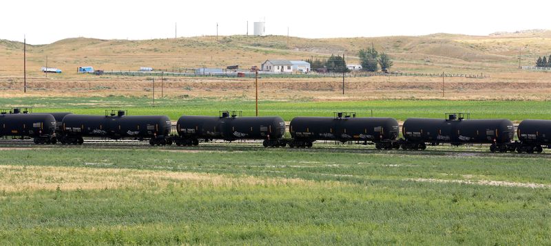 &copy; Reuters. FILE PHOTO: A crude oil train moves through the yard at an oil transloading facility in Ft. Laramie, Wyoming July 15, 2014.. REUTERS/Rick Wilking/File Photo