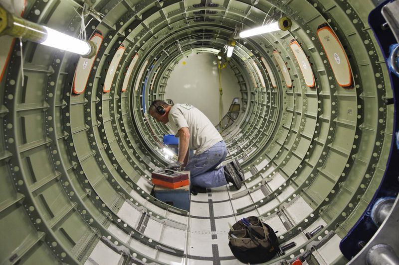 &copy; Reuters. Cessna employee Dwight Bennett works inside of a jet  during a tour of the Cessna business jet assembly line at their manufacturing plant in Wichita, Kansas August 14, 2012. REUTERS/Jeff Tuttle/File Photo