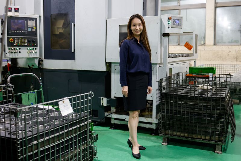 © Reuters. Hota's CEO Holly Sheng poses for a photo in their factory in Taichung, Taiwan November 13, 2023. REUTERS/Ann Wang