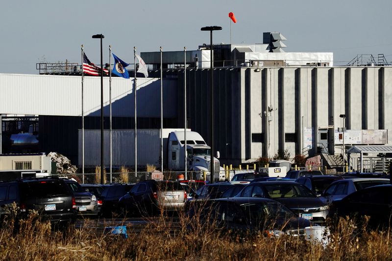 &copy; Reuters. FILE PHOTO: A semi truck and trailer exit the JBS USA Worthington pork plant in Worthington, Minnesota, U.S., October 28, 2020. REUTERS/Bing Guan/File Photo