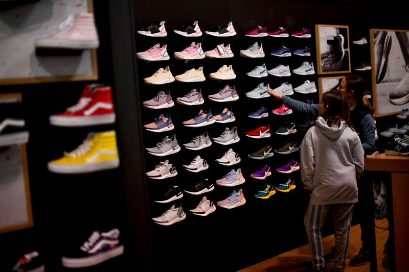 &copy; Reuters. FILE PHOTO: Audrey Topkin, 11, selects sneakers with her mother, Robyn, at a Dick's Sporting Goods store as pre-Thanksgiving and Christmas holiday shopping accelerates at the King of Prussia Mall in King of Prussia, Pennsylvania, U.S. November 22, 2019. R