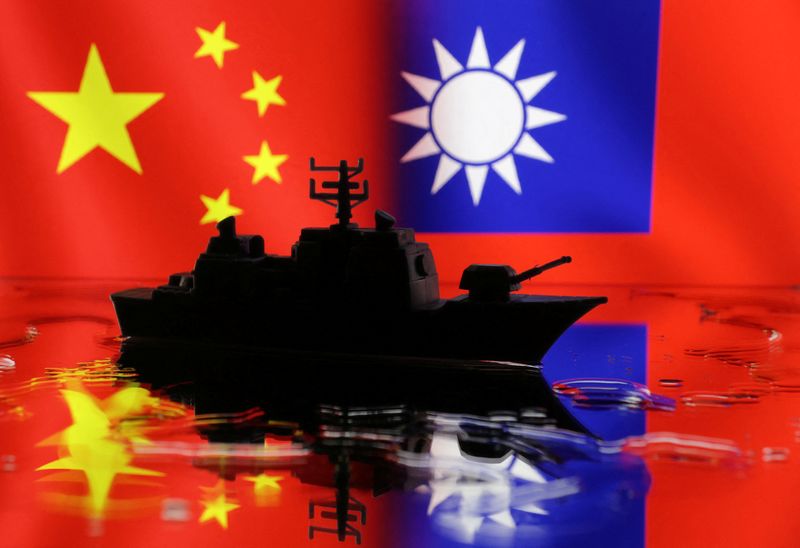 © Reuters. FILE PHOTO: A Navy miniature is seen in front of displayed Chinese and Taiwanese flags in this illustration taken, April 11, 2023. REUTERS/Dado Ruvic/Illustration/File photo