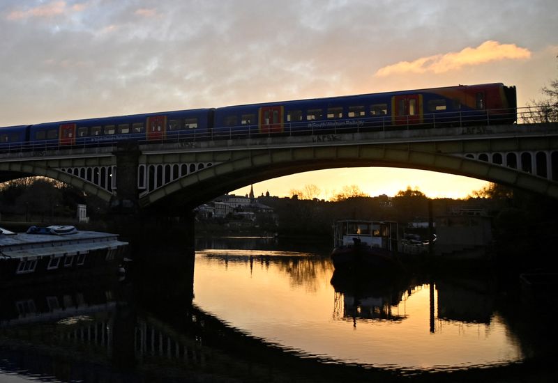 &copy; Reuters. FILE PHOTO: A train crosses the river Thames at sunrise as British railway workers strike over pay and conditions, in Richmond, London, Britain, February 3, 2023. REUTERS/Toby Melville/File Photo