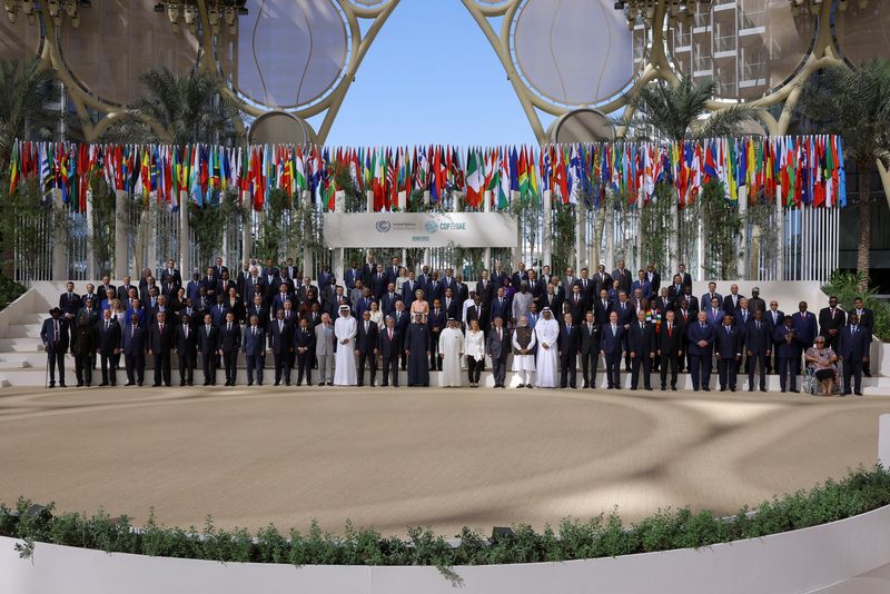 &copy; Reuters. President of the United Arab Emirates Sheikh Mohamed bin Zayed Al Nahyan, Antonio Guterres, Secretary-General of the United Nations, Britain's King Charles, and officials pose for a family photo during the United Nations Climate Change Conference (COP28) 