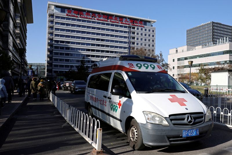 © Reuters. FILE PHOTO: An ambulance leaves a children's hospital in Beijing, China November 24, 2023. REUTERS/Florence Lo/File Photo