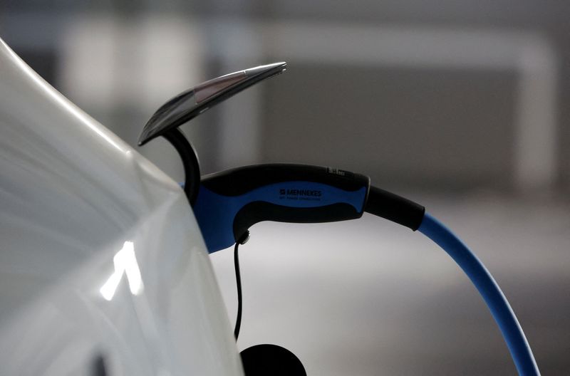 &copy; Reuters. FILE PHOTO: A Tesla electric vehicle is plugged to a charger Teia, north of Barcelona, Spain, October 31, 2023. REUTERS/Albert Gea/File Photo