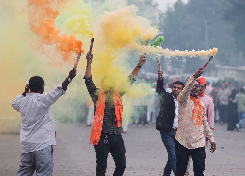 &copy; Reuters. FILE PHOTO: Supporters of India's ruling Bharatiya Janata Party (BJP) celebrate after winning three out of four states in key regional polls outside the party headquarters in Ahmedabad, India, December 3, 2023.REUTERS/Amit Dave/File Photo