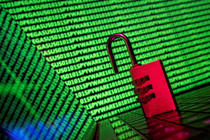 &copy; Reuters. FILE PHOTO: A padlock is seen in front of the word 'spyware' and binary code in this illustration taken May 4, 2022. REUTERS/Dado Ruvic/Illustration/File Photo