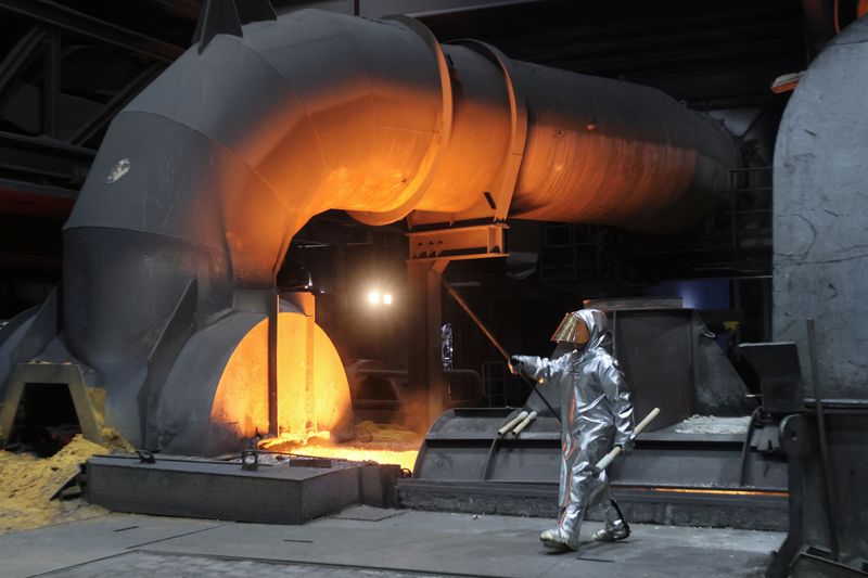 &copy; Reuters. A steel worker of ThyssenKrupp walks in front of a blast furnace at a ThyssenKrupp steel factory in Duisburg, western Germany, November 14, 2022. REUTERS/Wolfgang Rattay/File Photo