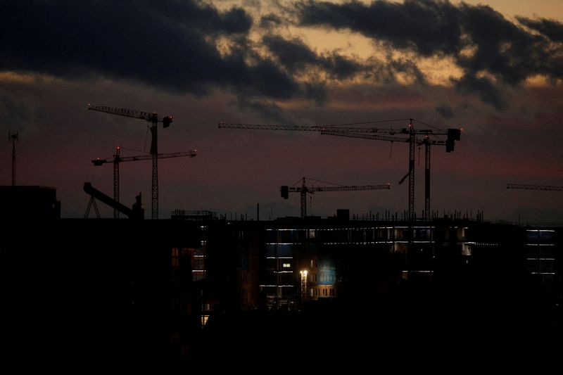 &copy; Reuters. FILE PHOTO: Construction cranes are seen at dusk at an apartment complex under construction in Madrid, Spain, November 21, 2022. REUTERS/Susana Vera/File Photo