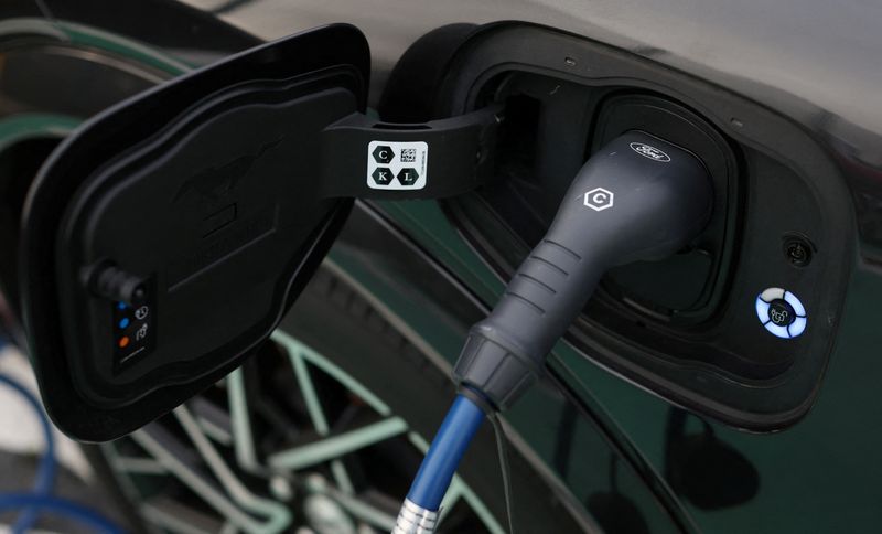 &copy; Reuters. FILE PHOTO: A Ford logo is seen on an electric vehicle charging cable during a press event at the Ford Halewood transmissions plant in Liverpool, Britain, December 1, 2022. REUTERS/Phil Noble/File Photo