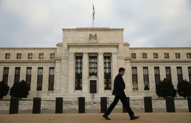 &copy; Reuters. A man walks past the Federal Reserve in Washington, December 16, 2015. REUTERS/Kevin Lamarque/File Photo