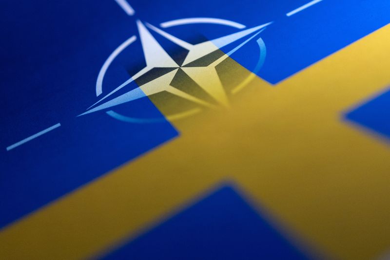 &copy; Reuters. FILE PHOTO: Swedish and NATO flags are seen printed on paper this illustration taken April 13, 2022. REUTERS/Dado Ruvic/Illustration/File photo