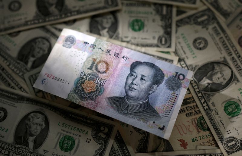 &copy; Reuters. FILE PHOTO: Chinese Yuan and U.S. dollar banknotes are seen in this illustration taken March 10, 2023. REUTERS/Dado Ruvic/Illustratio/File Photo