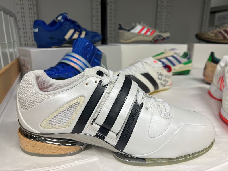 © Reuters. An Adidas weightlifting shoe made for the 2008 Beijing Olympics is pictured, among other Olympic shoes, at the Adidas archive in the company's headquarters in Herzogenaurach, Germany, November 20, 2023. REUTERS/Helen Reid/File Photo