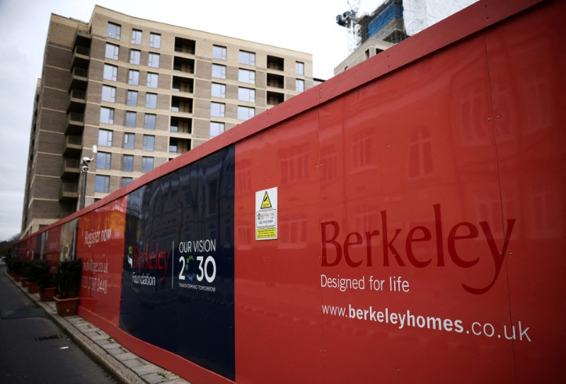 &copy; Reuters. FILE PHOTO: Hoardings display a logo of Berkeley Group outside a development in London, Britain, March 4, 2023. REUTERS/Henry Nicholls/File Photo