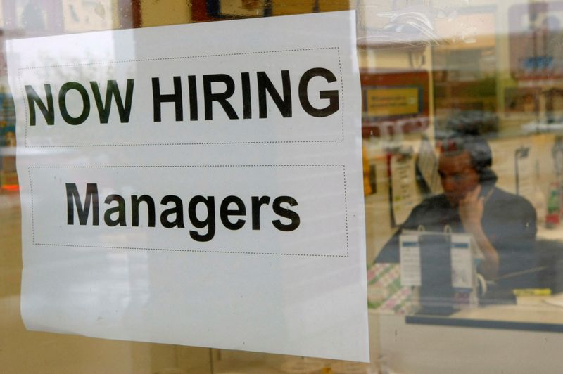 &copy; Reuters. FILE PHOTO: A hiring sign hangs in a window at PETCO in Falls Church, Virginia June 5, 2009.   REUTERS/Kevin Lamarque/File Photo
