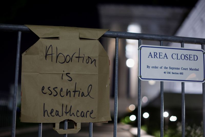 &copy; Reuters. A sign hangs on a fence outside the U.S. Supreme Court as protesters react to the leak of a draft majority opinion written by Justice Samuel Alito preparing for a majority of the court to overturn the landmark Roe v. Wade abortion rights decision later th