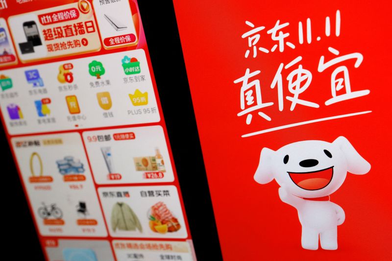 &copy; Reuters. The logo of e-commerce app JD.com is displayed  next to a mobile phone displaying the app, in this illustration picture taken October 25, 2023. REUTERS/Florence Lo/Illustration/FILE PHOTO