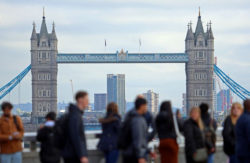 &copy; Reuters. People walk over London Bridge looking at a view of Tower Bridge in the City of London financial district in London, Britain, October 25, 2023.  REUTERS/ Susannah Ireland/file photo