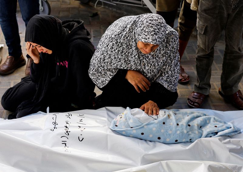 &copy; Reuters. The grandmother of Palestinian baby Idres Al-Dbari, who was born during the war and killed in an Israeli strike in the ongoing conflict between Israel and the Palestinian Islamist group Hamas, and a relative react at Abu Yousef al-Najjar hospital in Rafah