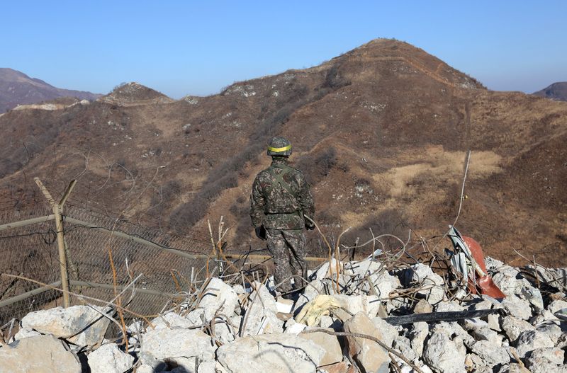 &copy; Reuters. FILE PHOTO: A South Korean army soldier stands guard at the South's dismantled guard post inside the Demilitarized Zone (DMZ) in the central section of the inter-Korean border in Cheorwon, December 12, 2018. Ahn Young-joon/Pool via REUTERS/File Photo