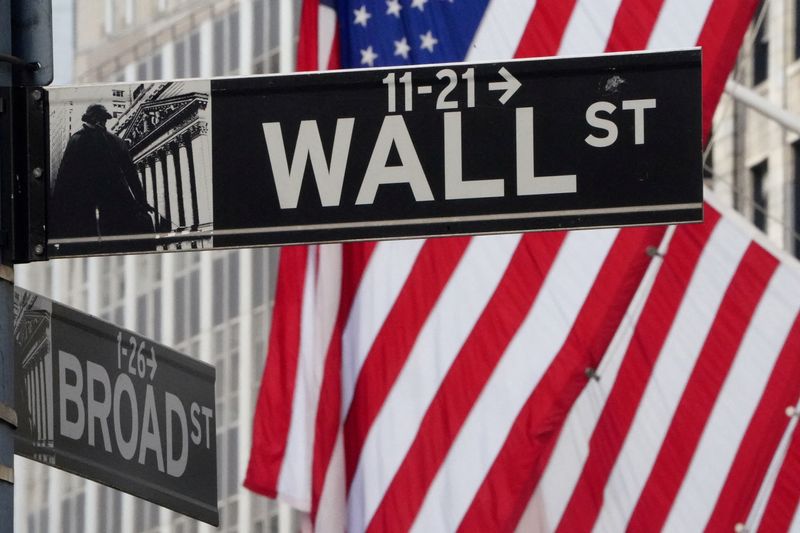 &copy; Reuters. FILE PHOTO: The Wall Street sign is pictured at the New York Stock exchange (NYSE) in the Manhattan borough of New York City, New York, U.S., March 9, 2020. REUTERS/Carlo Allegri//File Photo