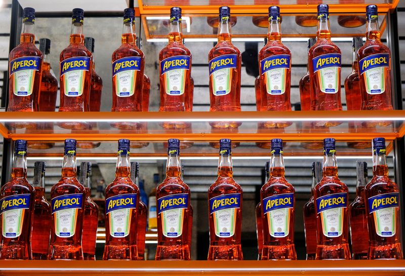 &copy; Reuters. FILE PHOTO: Bottles of Aperol are seen on display at a Campari inauguration of a new brand house for Aperol, its best-selling beverage, in Venice. Italy, August 30, 2021. REUTERS/Manuel Silvestri/File Photo