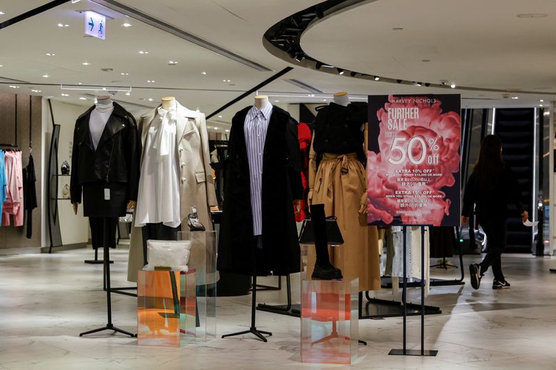 &copy; Reuters. A woman walks inside Harvey Nichols, a London-headquartered multi-brand luxury retailer, at Landmark, the upscale shopping mall, in Hong Kong, China November 30, 2023. REUTERS/Tyrone Siu