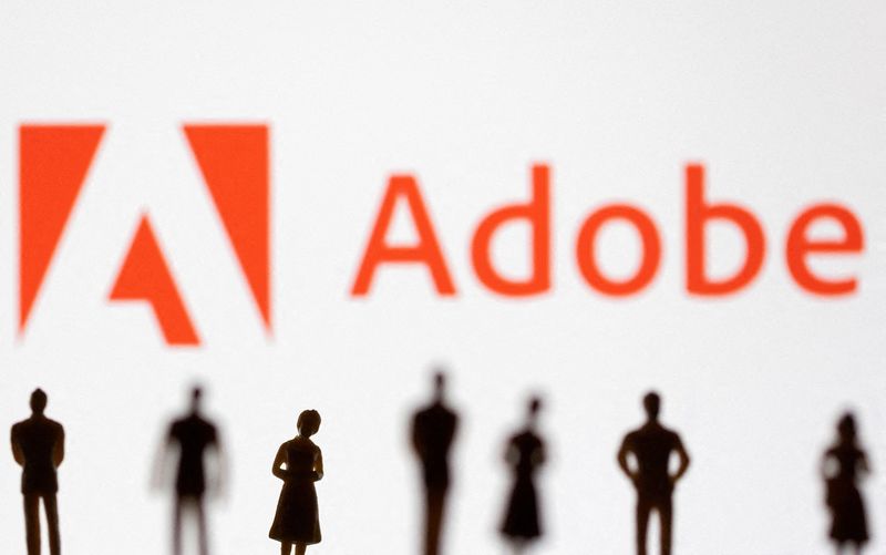 &copy; Reuters. FILE PHOTO: Figurines are seen in front of displayed Adobe logo in this illustration taken June 13, 2022. REUTERS/Dado Ruvic/Illustration/File Photo