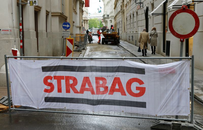 &copy; Reuters. FILE PHOTO: The logo of Austrian construction firm Strabag is seen on the fence blocking a road in Vienna, Austria, April 18, 2016. REUTERS/Heinz-Peter Bader/File Photo