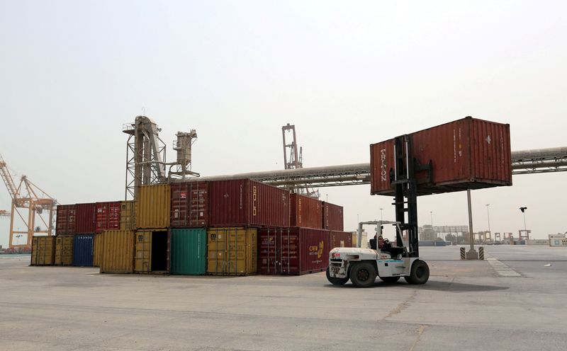 &copy; Reuters. FILE PHOTO: A forklift carries a shipping container at the Red Sea port of Hodeidah, Yemen June 24, 2018. REUTERS/Abduljabbar Zeyad/File Photo