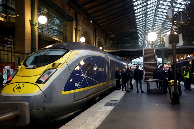 &copy; Reuters. People stand on a platform at the Eurostar terminal at Gare du Nord train station, as an unexpected strike by French workers at Eurotunnel, the undersea link between Britain and continental Europe, interrupted cross-Channel rail traffic, threatening the C