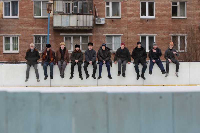 © Reuters. Actors sit on an ice rink's board in this undated production still from the series 